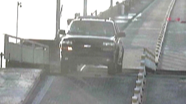 Distracted driver crashes gate, goes airborne on drawbridge