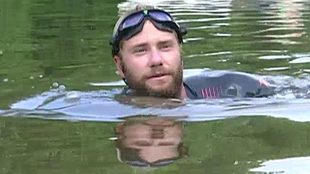Vet swims Mississippi River for families of fallen troops