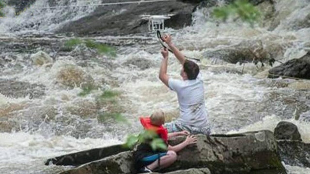 Drone helps firefighters rescue people from Maine river