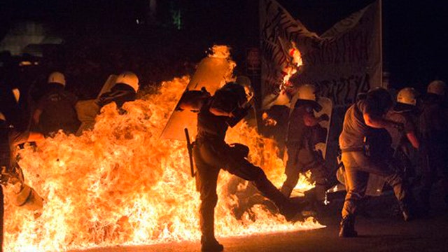 Greek protesters riot as parliament accepts Eurozone bailout