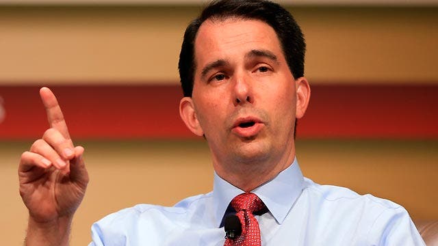 Gov. Scott Walker defends record against Trump attack