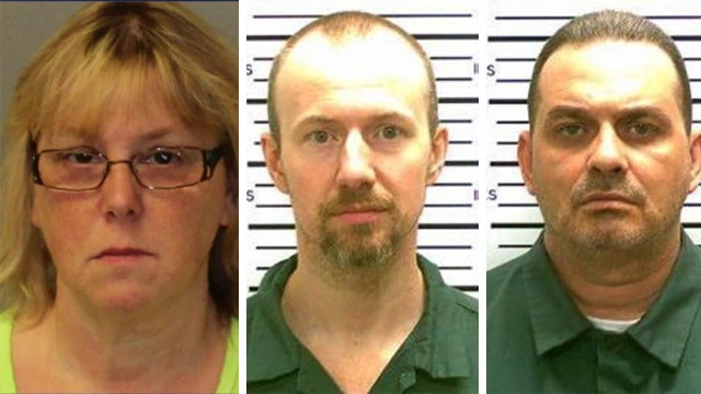 Prisoner worker accused of aiding in escape appears in court