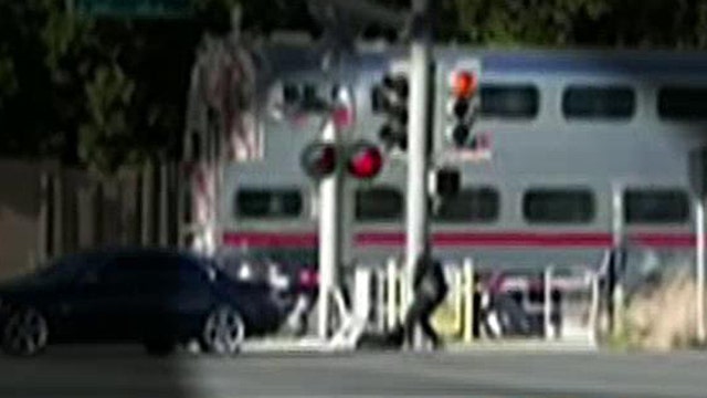 Cop saves man from oncoming train with just seconds to spare