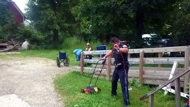 Cops help mow lawn for man in wheelchair