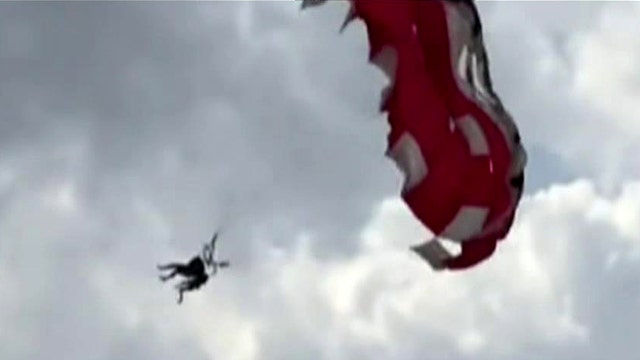 Horrified beachgoers watch as winds snap parasailers' cord