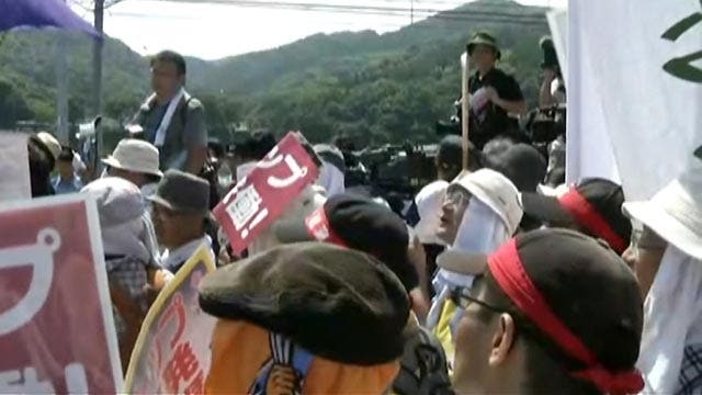 Protests as Japan returns to nuclear power