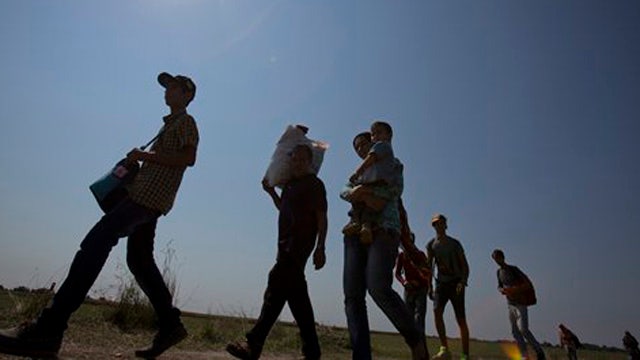 Hungary finishing border fence amid surge of migrants