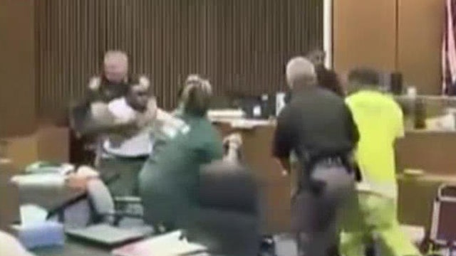 Dad attacks daughter's killer in court