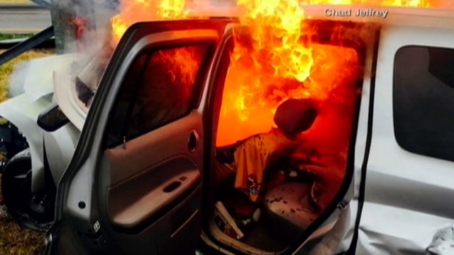 Good Samaritans rescue woman from burning car