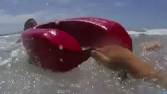 Dramatic video of lifeguard saving swimmers from rip current