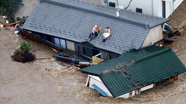 Houses washed away as river bursts banks during heavy rain