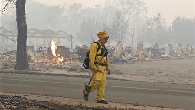 Fire Official: Wildfire has destroyed more than 100 homes