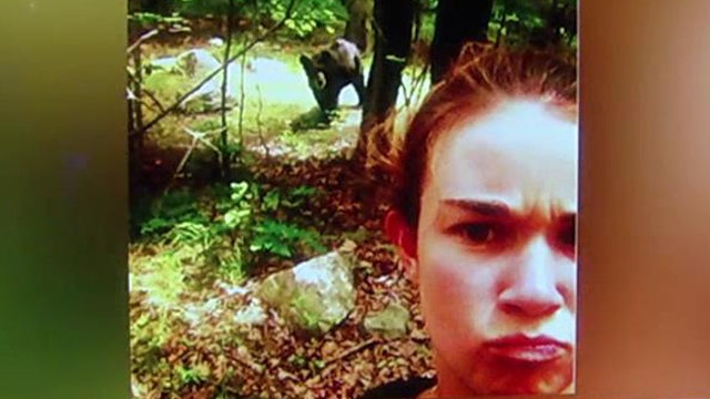 What would compel someone to take a selfie with a bear?