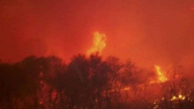 Raging California wildfires cause thousands to evacuate