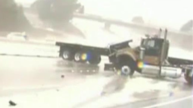 Out-of-control truck nearly crushes news crew on highway