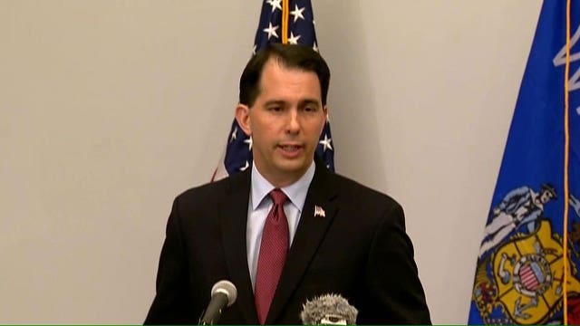 Walker suspends 2016 campaign, urges other to do the same