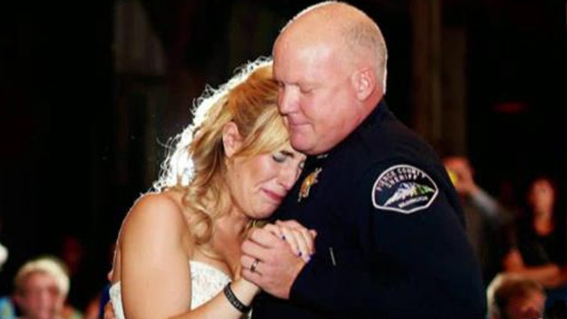 Officers dance with bride in honor of her late father