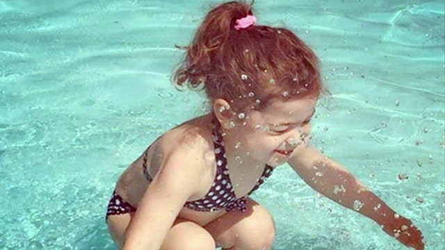 Puzzling picture: Is the girl in this photo underwater?