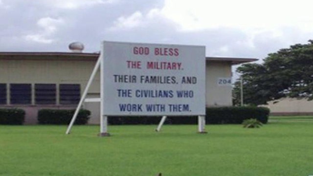 Group demands 'God bless the military' sign removed