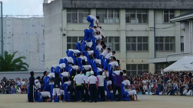 Plummeting pyramid! Students injured attempting stunt