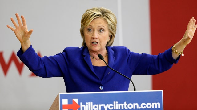 Classified info, hacking attempts downplayed by Clinton