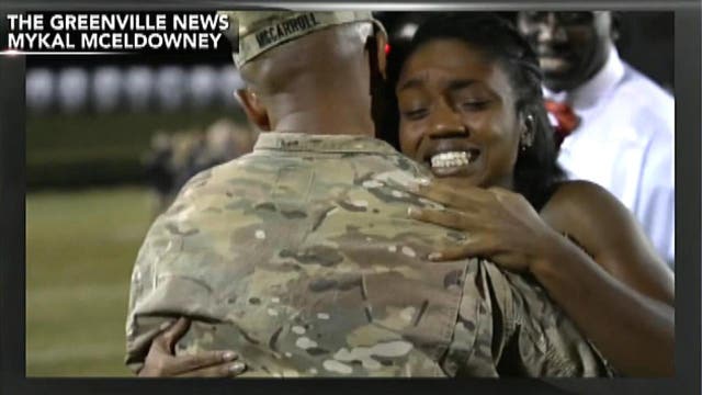 Sergeant surprises daughter at football game