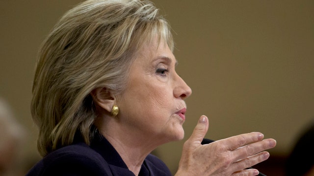 Clinton challenged on e-mails, security at Benghazi hearing