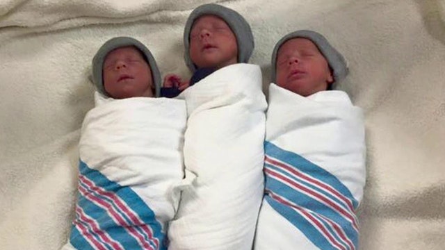 Extremely rare identical triplets born now home