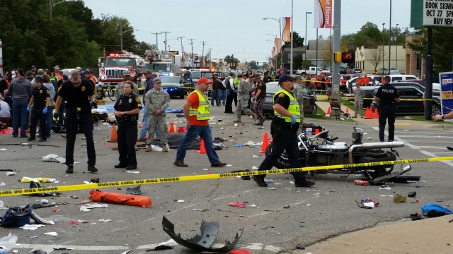 Report: 3 dead, 22 hurt after car crashes into parade