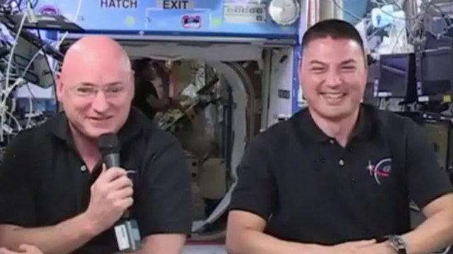 Astronauts perform historic spacewalk outside ISS