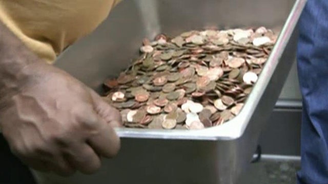 Penny pinching pays off! Man cashes in $5000 in coins