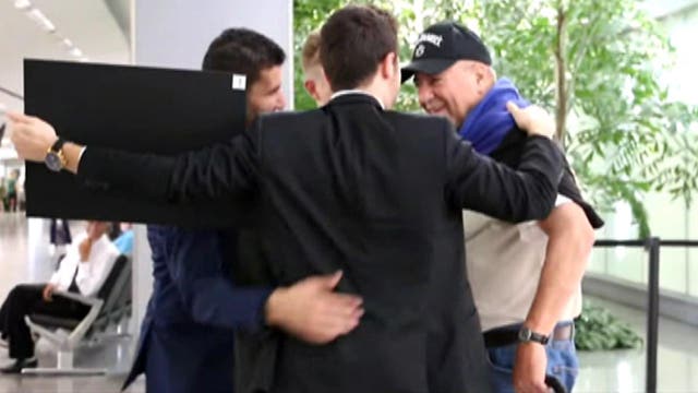 Men offer hugs to complete strangers