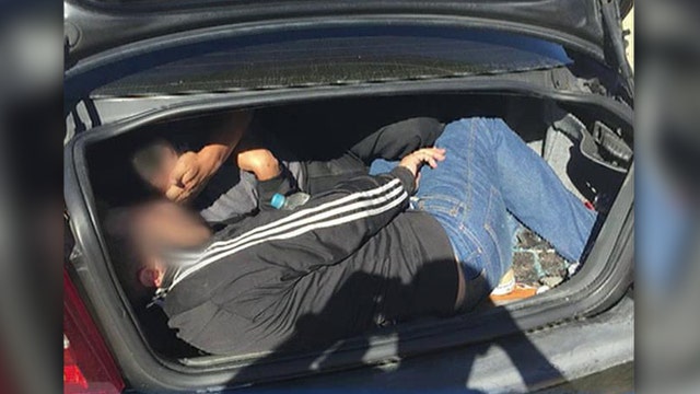 Illegal immigrants caught crammed into car's trunk