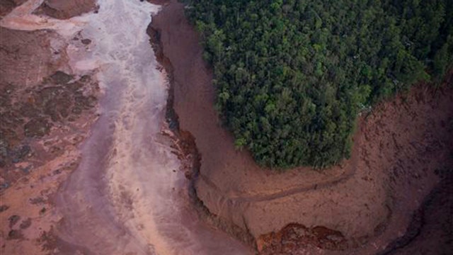 Mudslide triggered by burst dams buries entire village