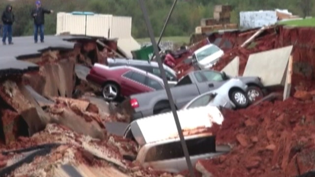 Giant sinkhole swallows cars in IHOP parking lot