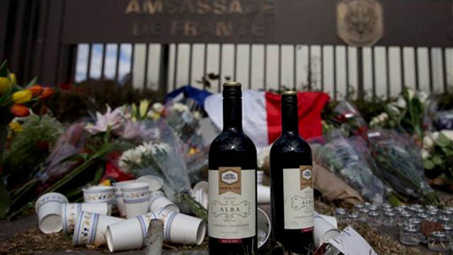 Memorial for attack victims grows outside French embassy