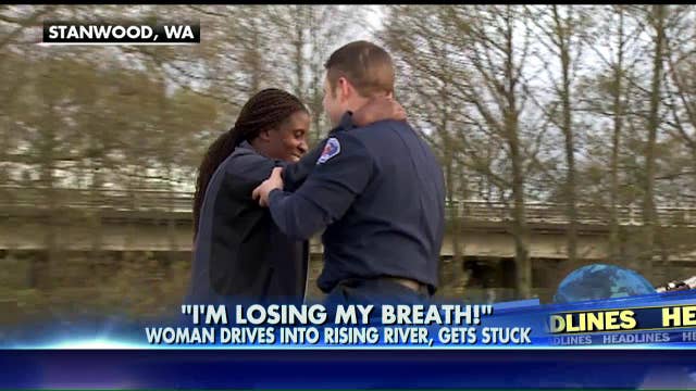Woman accidentally drives into rising river