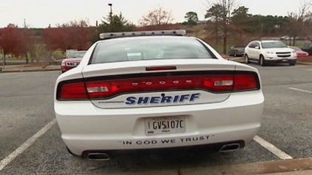 Sticky controversy over 'In God We Trust' decals