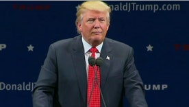 Trump demands guards confiscate coat from Vermont heckler