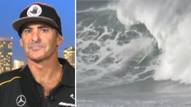 Wipeout! Pro surfer survives fall from monster 50-foot wave