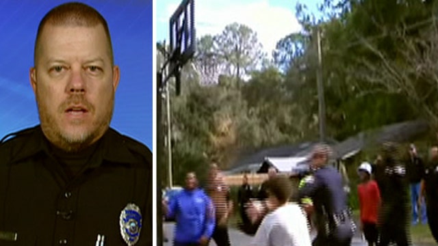 Fox Flash: Police officer plays basketball with kids