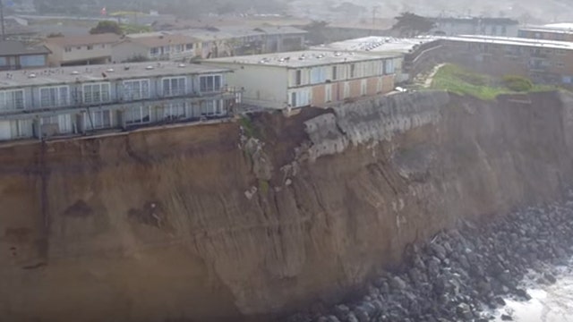 Drone footage of homes threatened by coastal erosion