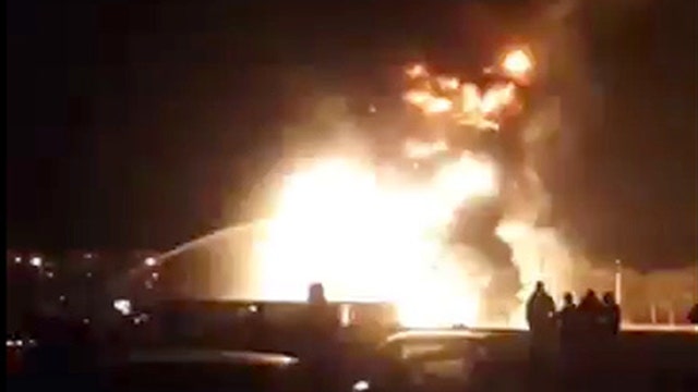 Gas station explodes as firefighters battle blaze