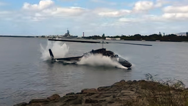 Watch as tourist helicopter crashes into Pearl Harbor