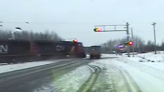 Moment of impact: Truck slammed by train, dragged down track