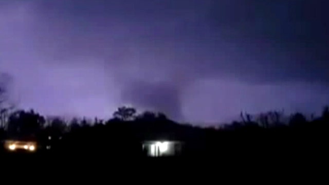 Tornado illuminated by lightning rips through Florida