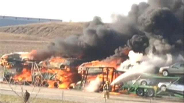 Massive blaze engulfs truck and trailer full of cars