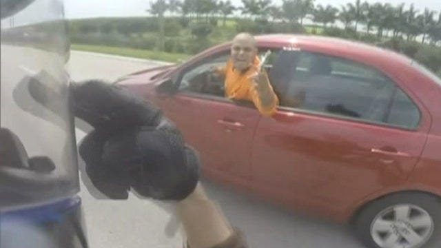 Insane road rage altercation caught on helmet cam