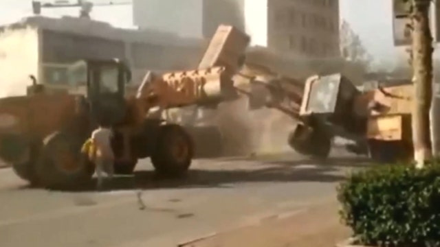 MOST WATCHED: Bulldozers battle in China as workers clash