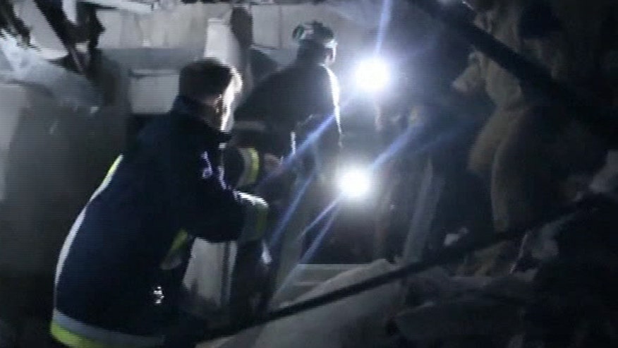 Rescue team searches the rubble for survivors